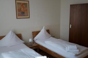 Postel nebo postele na pokoji v ubytování Hotel Milano