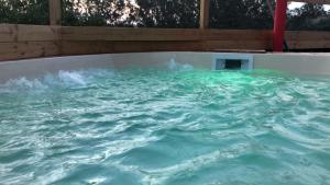 a hot tub with water in the middle at ConcaverdeClub in Sogliano al Rubicone