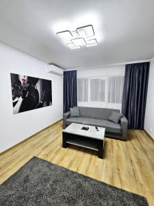 a living room with a couch and a coffee table at Casa Darius 2 in Alexandria