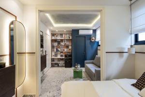 a bedroom with a bed and a blue door at Mulan Hotel in Tel Aviv