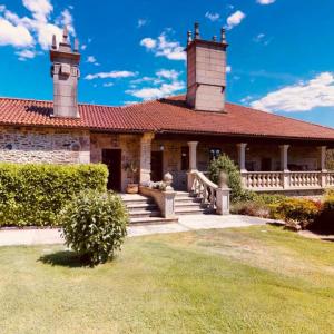 a house with two towers on top of it at Pazo de Bendoiro in Bendoiro