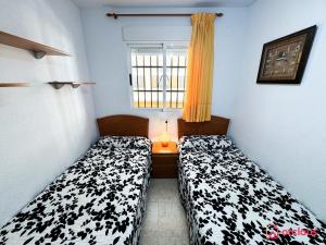 Postel nebo postele na pokoji v ubytování Escapada Marina