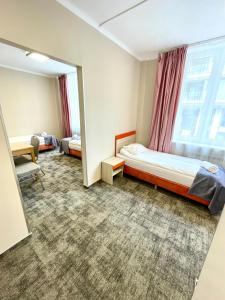 Postel nebo postele na pokoji v ubytování eMKa Hostel
