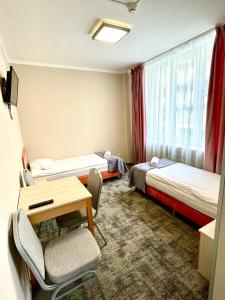 Postel nebo postele na pokoji v ubytování eMKa Hostel