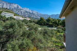 a view of the mountains from a house at Rooms Olive and Sea in Tučepi