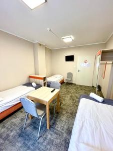 Postel nebo postele na pokoji v ubytování eMKa Hostel