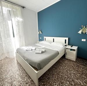 Postel nebo postele na pokoji v ubytování Hotel Baia di Levanto