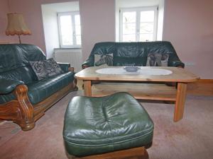 a living room with a couch and a coffee table at Apartment in Schultenbrook with garden in Metelsdorf