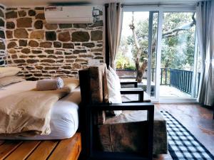 Ένα ή περισσότερα κρεβάτια σε δωμάτιο στο Gusto Accommodation