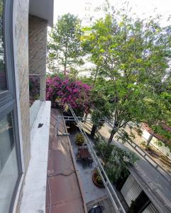 an overhead view of a balcony with trees and flowers at Biệt thự Thu Le in Ho Chi Minh City