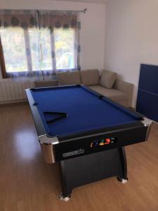 a blue pool table in a living room at Casa Bellavista con piscina en Caldes Costa Brava in Caldes de Malavella