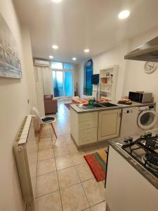 a kitchen with a sink and a stove top oven at Discesa Marina in Ventimiglia