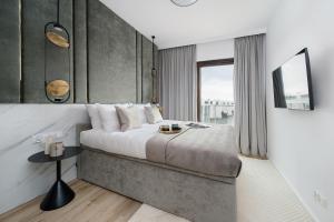Postel nebo postele na pokoji v ubytování Sol Marina Resort Wyspa Sobieszewska II - LoftAffair Collection