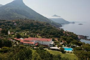 an aerial view of a house on a hill next to the water at Santavenere Hotel in Maratea