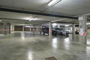 an empty parking garage with cars parked in it at Condominio Maria Ida in Caorle