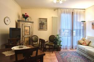 a living room with a couch and a table at Condominio Maria Ida in Caorle