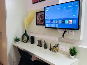 TV o dispositivi per l'intrattenimento presso Sunset View Paradise By Buddies Home