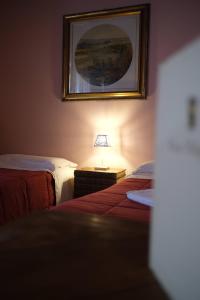 Postel nebo postele na pokoji v ubytování Agriturismo Corte Pellegrini