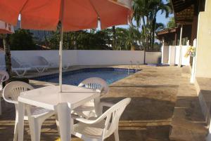 La alberca dentro o cerca de Pousada A Cor Do Sol 14 fotos más