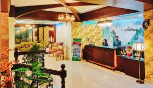 a lobby of a store with a counter at Hotel Crystal Rose - Sylhet in Sylhet