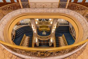 an overhead view of a theatre with a spiral staircase at El Avenida Palace in Barcelona