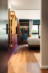 Ein Bett oder Betten in einem Zimmer der Unterkunft Hotel Schani UNO City
