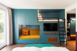 Ein Bett oder Betten in einem Zimmer der Unterkunft Hotel Schani UNO City