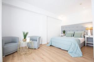 Ένα ή περισσότερα κρεβάτια σε δωμάτιο στο FLEMING PLAYA PONIENTE