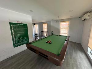 a billiard room with a pool table in a room at One Spatial Condominium, 2-Bedroom Unit #2920 in Iloilo City