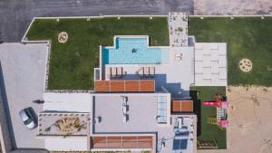 a plan of a house with a swimming pool at Star Luxury Villa - Private pool, gym, playground in Kato Daratso
