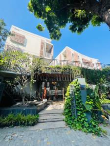 a building with a staircase in front of it at Glenwood City Resort in Ho Chi Minh City