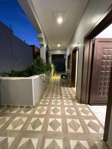 a hallway of a building with ailed floor at استراحة صيفيه بالهدا الطائف in Al Hada