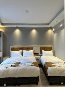 Postel nebo postele na pokoji v ubytování Sareban Hotel Istanbul