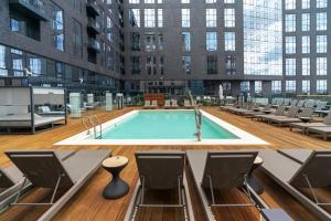 a large building with a pool in the middle of it at Boston Club Quarters by Orchard Group in Cambridge