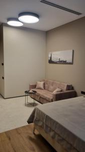 a living room with a couch at Sea Breeze Lighthouse 3 in Baku +2 photos