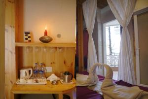 ein Zimmer mit einem Tisch und einer Kerze darauf in der Unterkunft Hotel Gandhi's Paradise in Dharamshala