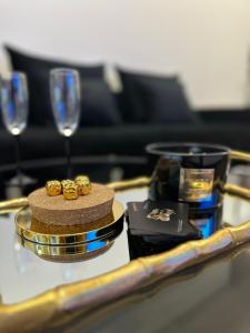 a table with a gold tray with gold rings on it at Luksusowy Apartament Joker 2 in Szklarska Poręba