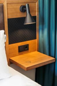 Ein Bett oder Betten in einem Zimmer der Unterkunft Hotel Schani UNO City