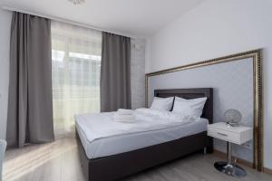 Posteľ alebo postele v izbe v ubytovaní Ovo Chic Studio