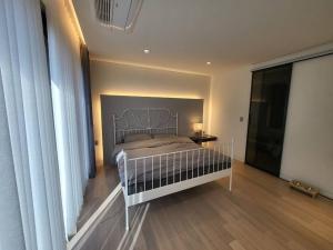 a bedroom with a bed with a metal head board at Stay Beff in Gwangju +15 photos
