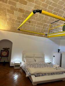 Ένα ή περισσότερα κρεβάτια σε δωμάτιο στο Casa Vacanze Il Belvedere Sui Sassi Suite