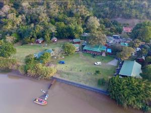 an aerial view of a house next to the water at Port St Johns River Lodge in Port St. Johns