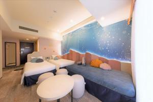a childrens room with two beds and a space mural at Hotel Keihan Universal Tower in Osaka