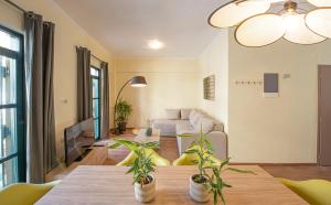 a living room with a couch and a table at Madrugada in Chania