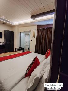 Letto o letti in una camera di Divan Clarks Inn Goa