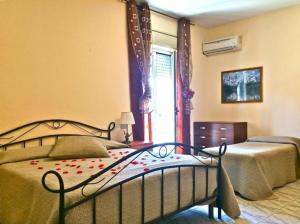 Postel nebo postele na pokoji v ubytování Park Hotel Paradiso