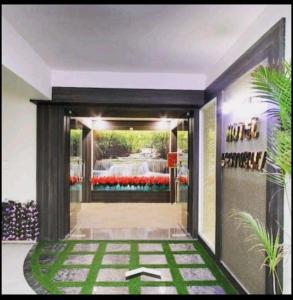 an entrance to a building with a door with grass at Hotel Best Elegence in Gandhinagar