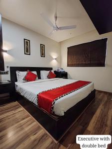 Letto o letti in una camera di Divan Clarks Inn Goa