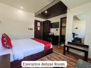 Letto o letti in una camera di Divan Clarks Inn Goa