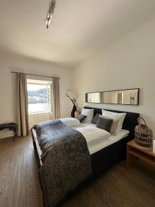 a bedroom with a large bed and a window at Schloß Ort in Passau